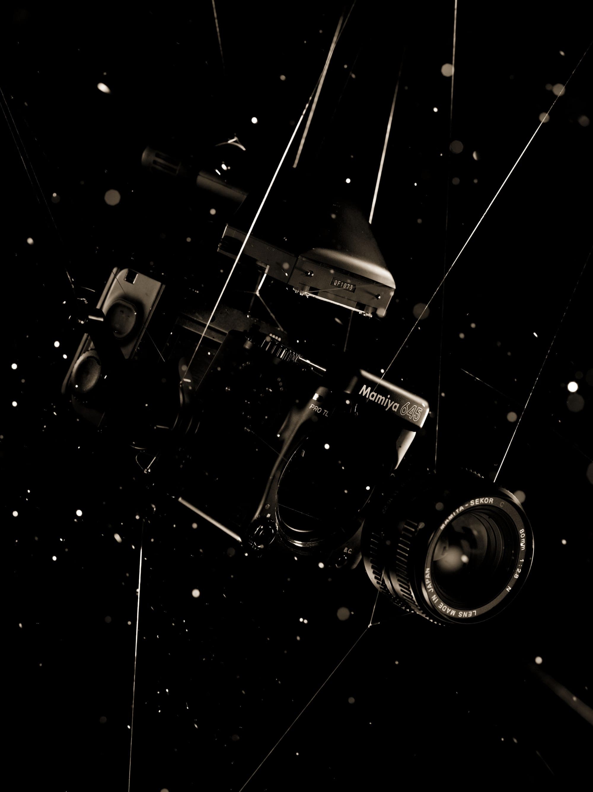 Lighting rig hanging in a dark studio
